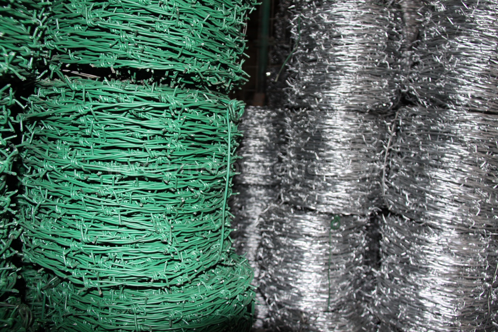 PVC-coated and galvanized barbed wire coils prepared for supply
