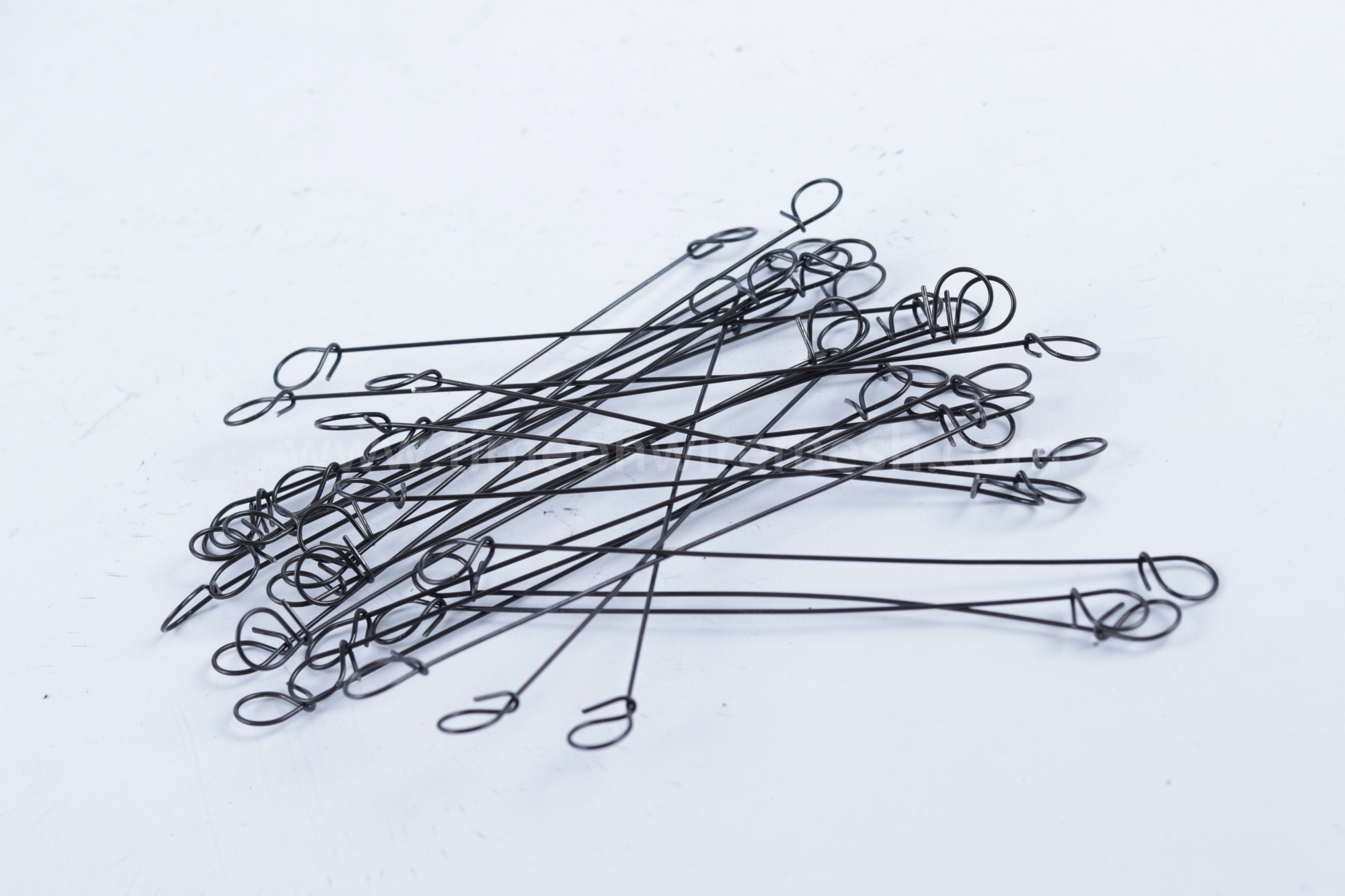 Loose black loop tie wires showing their full length