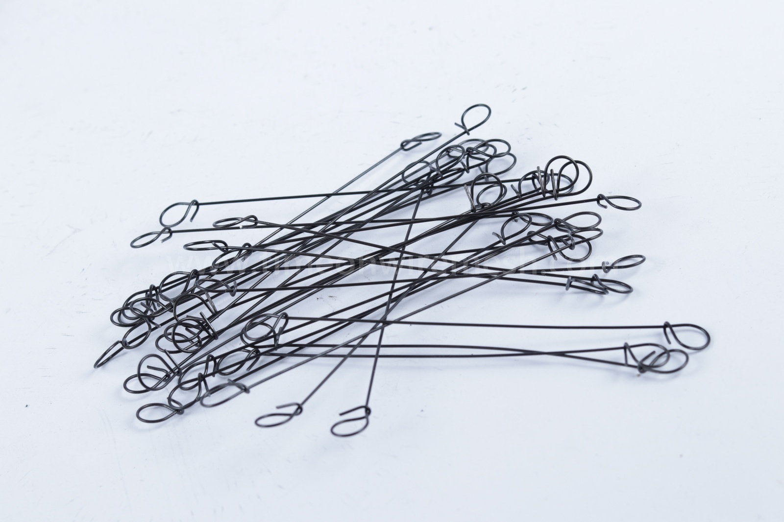 Loose black loop tie wires showing their full length